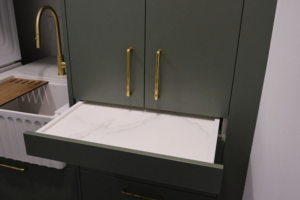 Kirsty's custom laundry with farm-style butler's sink and Staron acrylic bench to and Blum pullout locking shelf with Staron Acrylic base and some beautiful antique brass handles