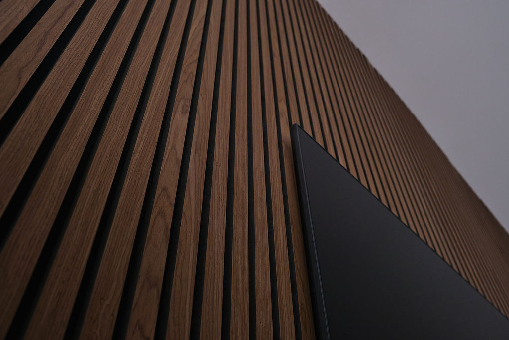 walnut slats around TV
